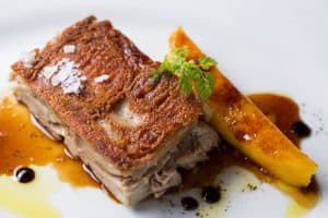 Segovian boneless suckling pig with caramelized mango