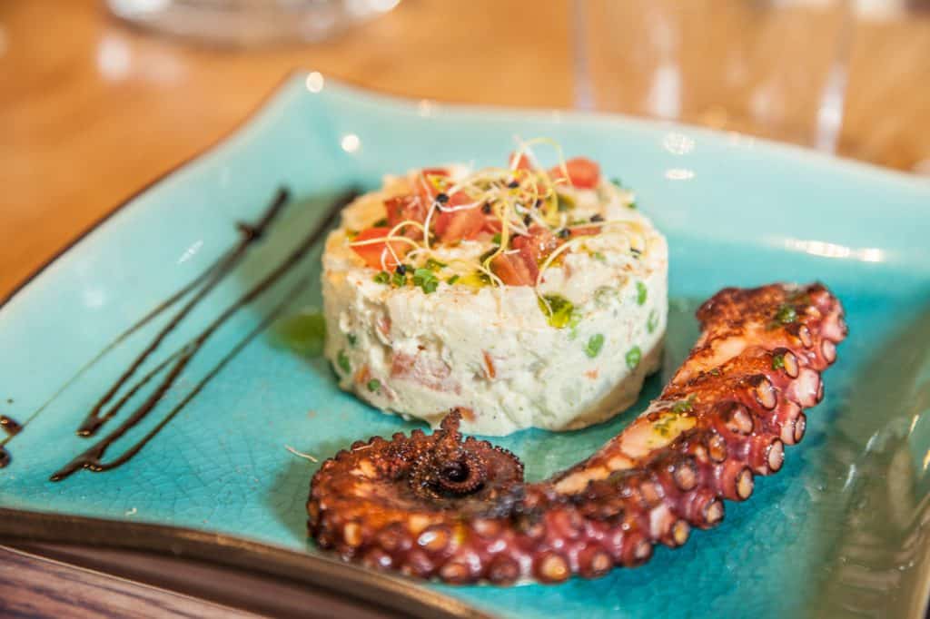Grilled octopus with potato & carrot salad and avocado sauce