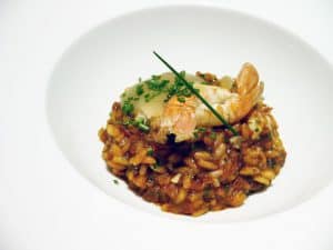 Arròs de sobrassada, escamarlans, pera i gingebre