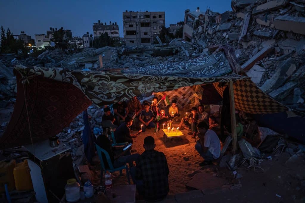 Gaza Residents Return to Destroyed Homes As Ceasefire Holds Palestinian Children in Gaza by Fatima Shbair Getty Images. (2022 Photo Contest, Asia, Singles).