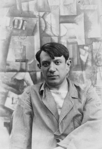 Picasso in front of his painting The Aficionado (Kunstmuseum Basel) at Villa les Clochettes, summer 1912